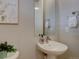 Chic powder room features a stylish pedestal sink and modern fixtures creating a functional space for guests at 1031 Turnberry Cir, Louisville, CO 80027