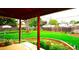 Lush backyard featuring a well-maintained lawn, mature trees, and inviting landscaping at 11823 Williams Way, Northglenn, CO 80233