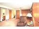 Partially finished basement with wood paneling, chair, and various storage areas at 11823 Williams Way, Northglenn, CO 80233