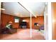 Basement featuring paneled walls, a window, and a television at 11823 Williams Way, Northglenn, CO 80233