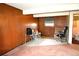 Finished basement features paneled walls, a window, and a tile floor at 11823 Williams Way, Northglenn, CO 80233