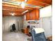 Unfinished basement with open ceiling, shelving, and concrete floor offers potential for customization at 11823 Williams Way, Northglenn, CO 80233