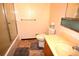 Full bath with single sink vanity and shower-tub combo at 11823 Williams Way, Northglenn, CO 80233