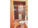 Compact bathroom featuring a glass door shower and neutral colors at 11823 Williams Way, Northglenn, CO 80233