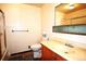 Bathroom featuring a shower, toilet, vanity, and mirror at 11823 Williams Way, Northglenn, CO 80233