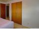 This bedroom features a ceiling fan, neutral walls, carpet, and a closet at 11823 Williams Way, Northglenn, CO 80233
