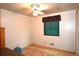 Cozy bedroom features a ceiling fan and a window with pleated green blinds at 11823 Williams Way, Northglenn, CO 80233