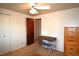 Cozy bedroom featuring a ceiling fan, desk with chair, and storage cabinet at 11823 Williams Way, Northglenn, CO 80233