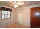 Standard bedroom with ceiling fan, closet, window view, and light pink carpet at 11823 Williams Way, Northglenn, CO 80233