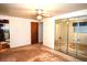 Bedroom featuring mirrored closet doors and a ceiling fan for added comfort at 11823 Williams Way, Northglenn, CO 80233