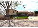 Charming two-story home with a well-maintained front yard, brick wall and an American flag at 11823 Williams Way, Northglenn, CO 80233