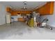 Spacious garage interior with ample storage cabinets, and room for projects at 11823 Williams Way, Northglenn, CO 80233