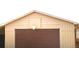 Garage with brown garage door and basketball hoop at 11823 Williams Way, Northglenn, CO 80233