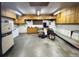 Spacious garage featuring built-in cabinets and ample storage space for tools and equipment at 11823 Williams Way, Northglenn, CO 80233