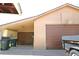Spacious garage with brown garage door and basketball hoop attached at 11823 Williams Way, Northglenn, CO 80233