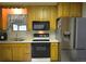 Well-equipped kitchen featuring stainless steel appliances and warm wood cabinets at 11823 Williams Way, Northglenn, CO 80233