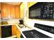 Bright kitchen features wood cabinets, white countertops, and modern appliances at 11823 Williams Way, Northglenn, CO 80233