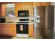 Kitchen with black appliances, light countertops, and a stainless steel refrigerator at 11823 Williams Way, Northglenn, CO 80233
