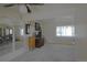 Bright and open living room with neutral carpeting and a ceiling fan at 11823 Williams Way, Northglenn, CO 80233