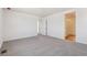 Spacious primary bedroom with neutral carpet, walk-in closet, and ensuite bathroom at 18971 E 96Th Pl, Commerce City, CO 80022