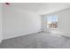 Bedroom featuring neutral carpet, large window, and ample natural light at 18971 E 96Th Pl, Commerce City, CO 80022
