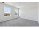 Spacious bedroom featuring neutral carpet, bright windows, and ample natural light at 18971 E 96Th Pl, Commerce City, CO 80022