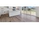 Modern kitchen area with stainless steel appliances, ample cabinet space, and light wood flooring at 18971 E 96Th Pl, Commerce City, CO 80022