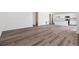 Open-concept living area with modern light wood floors and bright, airy feel at 18971 E 96Th Pl, Commerce City, CO 80022