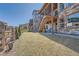 Spacious backyard with lush green grass, patio, and fence, perfect for outdoor enjoyment at 7994 S Kewaunee St, Aurora, CO 80016