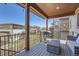 Outdoor deck with views of the surrounding community, featuring a grill and patio furniture at 7994 S Kewaunee St, Aurora, CO 80016