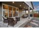 Relaxing patio area with outdoor seating, a grill, and a view of the landscaped backyard at 16400 Alberta Dr, Parker, CO 80134