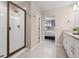 Updated bathroom features a tiled shower with glass door and modern fixtures at 16400 Alberta Dr, Parker, CO 80134