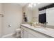 Bright bathroom featuring dual sinks, modern fixtures, and decorative accents at 16400 Alberta Dr, Parker, CO 80134
