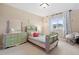 Cozy ' bedroom with plush carpeting, pastel-colored furniture, and natural light at 16400 Alberta Dr, Parker, CO 80134