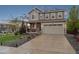 Charming two-story home with a well-manicured lawn, a two-car garage, and stylish curb appeal at 16400 Alberta Dr, Parker, CO 80134