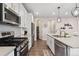 Well-equipped kitchen features stainless steel appliances, modern fixtures, and ample storage at 16400 Alberta Dr, Parker, CO 80134