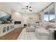 Bright and airy living room with a fireplace, television, and comfortable seating area at 16400 Alberta Dr, Parker, CO 80134