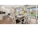 Spacious living area with a dining table, living room, and access to the outdoor patio at 16400 Alberta Dr, Parker, CO 80134