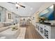Open-concept living space featuring a living room, dining area, and modern kitchen at 16400 Alberta Dr, Parker, CO 80134