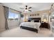 Spacious main bedroom with a large window, ceiling fan, and elegant decor creating a peaceful retreat at 16400 Alberta Dr, Parker, CO 80134