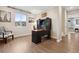 Bright office space featuring hardwood floors, natural light, and a modern desk setup at 16400 Alberta Dr, Parker, CO 80134