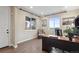 Bright office space featuring hardwood floors, natural light, and a modern desk setup at 16400 Alberta Dr, Parker, CO 80134