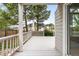 Home showcasing a spacious wooden deck, perfect for outdoor entertaining at 3205 S Tulare Ct, Denver, CO 80231
