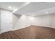 Spacious basement with wood flooring, ample storage, and a blank canvas for your dreams at 3205 S Tulare Ct, Denver, CO 80231