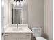 Modern bathroom features a sleek vanity with marble countertops and contemporary fixtures at 3205 S Tulare Ct, Denver, CO 80231