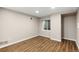 The bedroom features laminate wood floors at 3205 S Tulare Ct, Denver, CO 80231