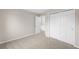 A bedroom with a closet and an entrance to another room, enhancing the functionality and connectivity at 3205 S Tulare Ct, Denver, CO 80231