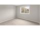 Neutral bedroom featuring a window that provides plenty of natural light at 3205 S Tulare Ct, Denver, CO 80231