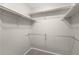 A walk-in closet with multiple shelves and racks for organized storage and efficient space utilization at 3205 S Tulare Ct, Denver, CO 80231