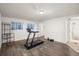 Finished basement features wood-look flooring and workout area, perfect for exercise and storage at 670 Winona Ct # 38, Denver, CO 80204